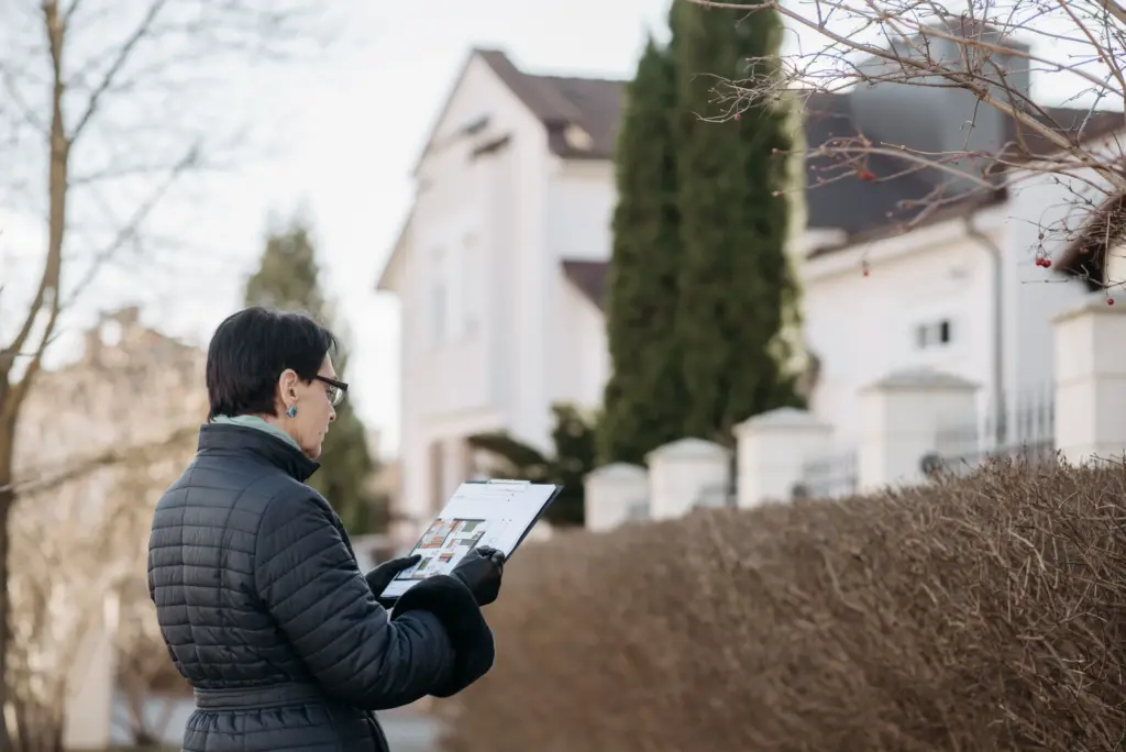 A Property surveyor inspecting a house for a valuation